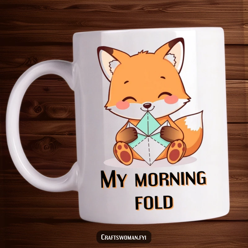 Funny Fox Mug showing a smiling fox carefully folding origami shapes with tiny paws, a perfect gift for crafters.