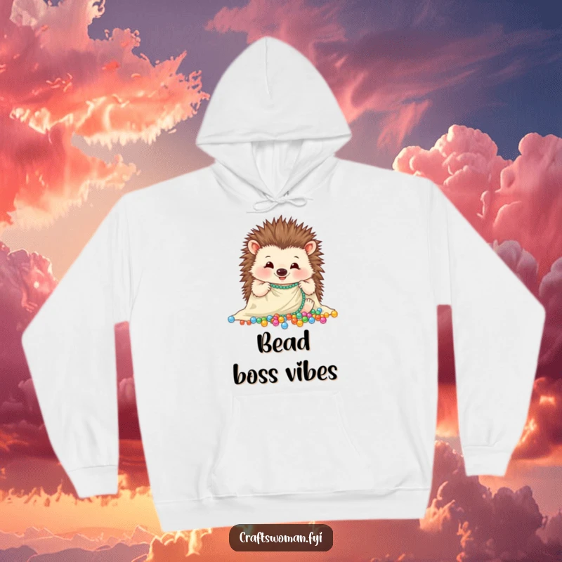 Funny hedgehog hoodie with a cheerful expression, carefully arranging sparkling beads onto a piece of cloth, cozy and warm.
