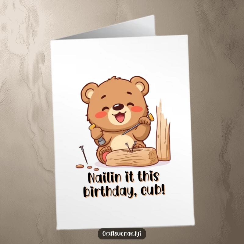 Funny Free Printable Birthday Card: Joyful bear cub gleefully hammers a tiny nail into a piece of wood with focus.