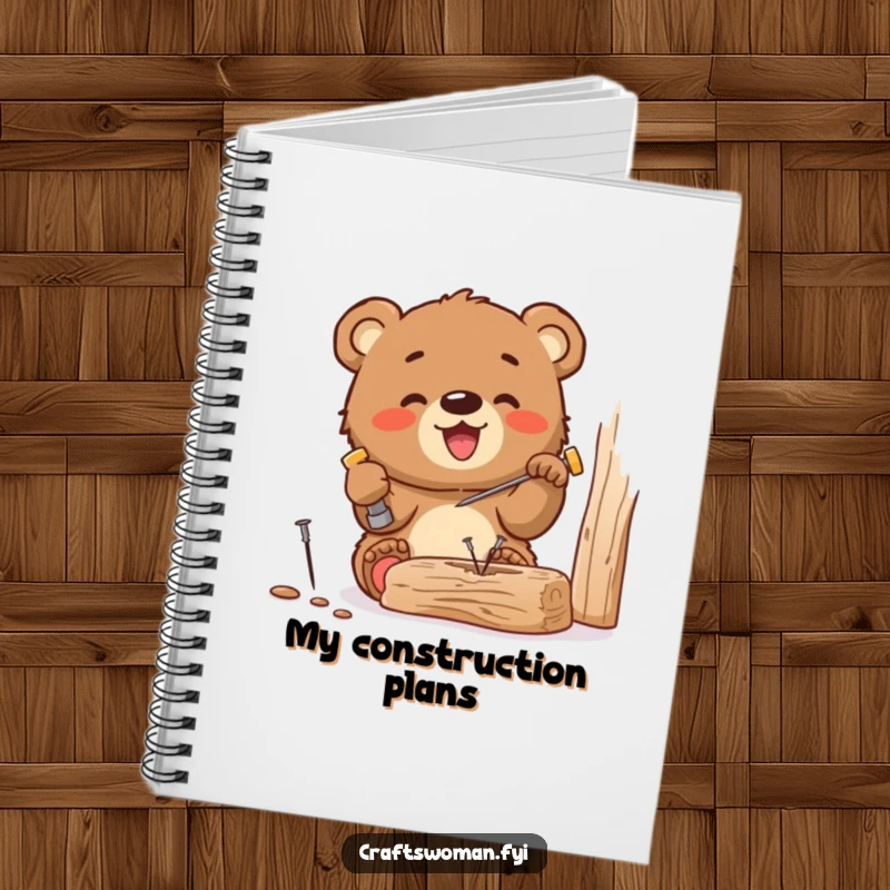 Funny notebook cover displaying a gleeful bear cub hammering a tiny nail into wood, perfect for planning DIY projects and jotting down ideas.