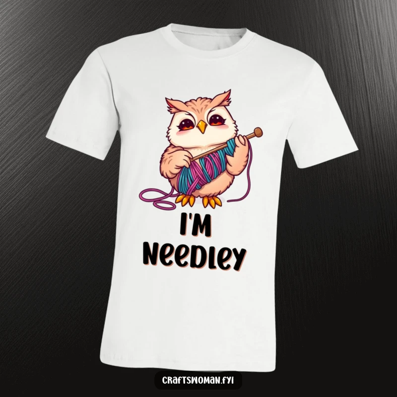 Funny Owl T-Shirt depicting a joyful owl skillfully threading a large needle with vibrant yarn, ideal for craft lovers.