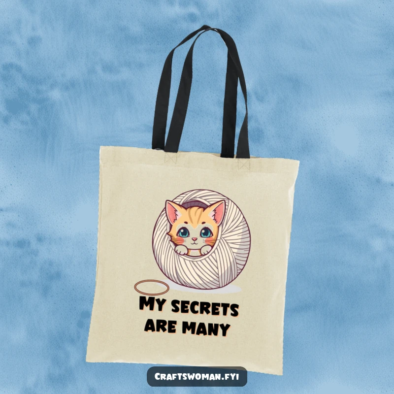 Funny tote bag with a curious cat peeking from behind a large spool of yarn, a perfect accessory for crafters.